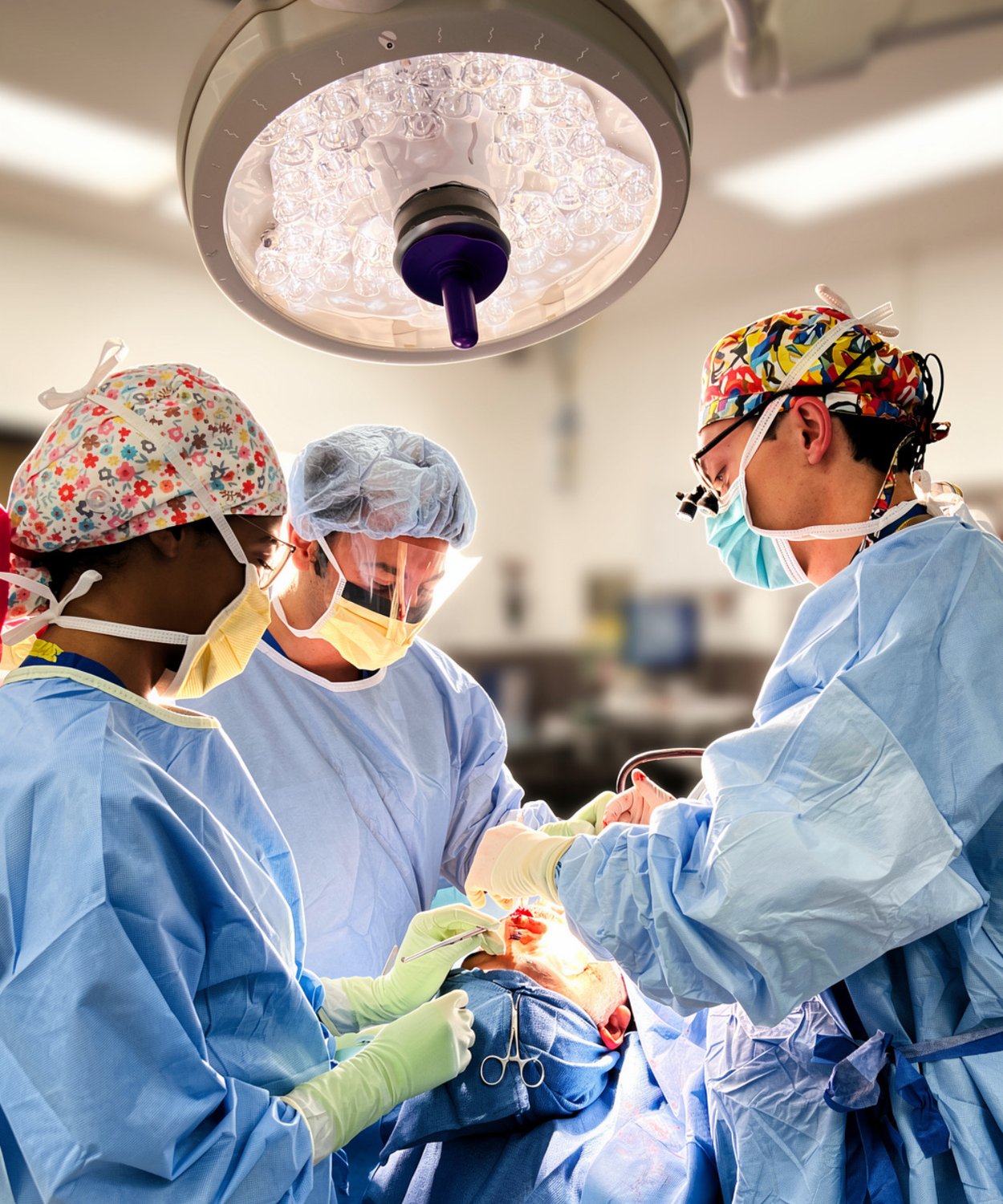 Dr. Andre Rafizadeh, fellowship-trained plastic surgeon in Morristown, NJ, operating in the OR