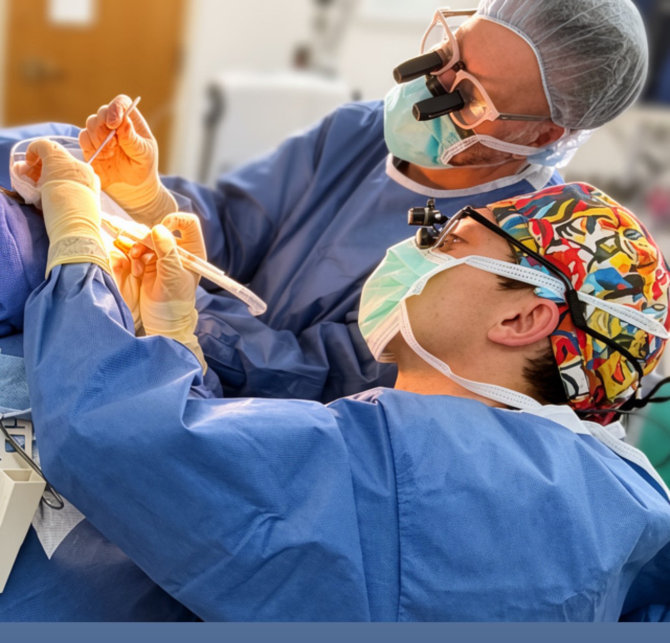 Dr. Andre Rafizadeh wearing surgical loupes during a plastic surgery procedure in Morristown, NJ